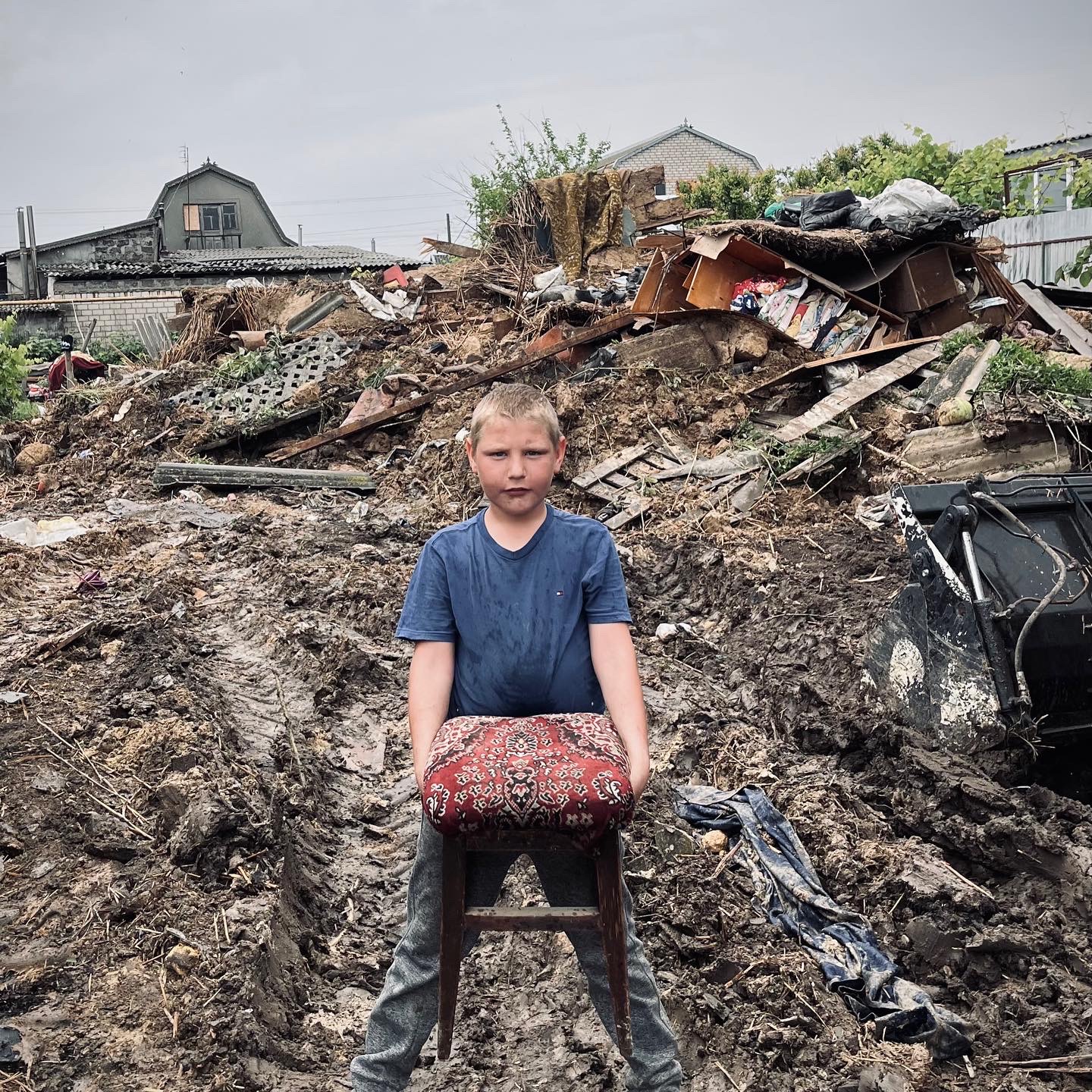 Only a chair left from what was his prents house in the region of the destroyed dam: images of Tolya are from Myroslav Laiuk